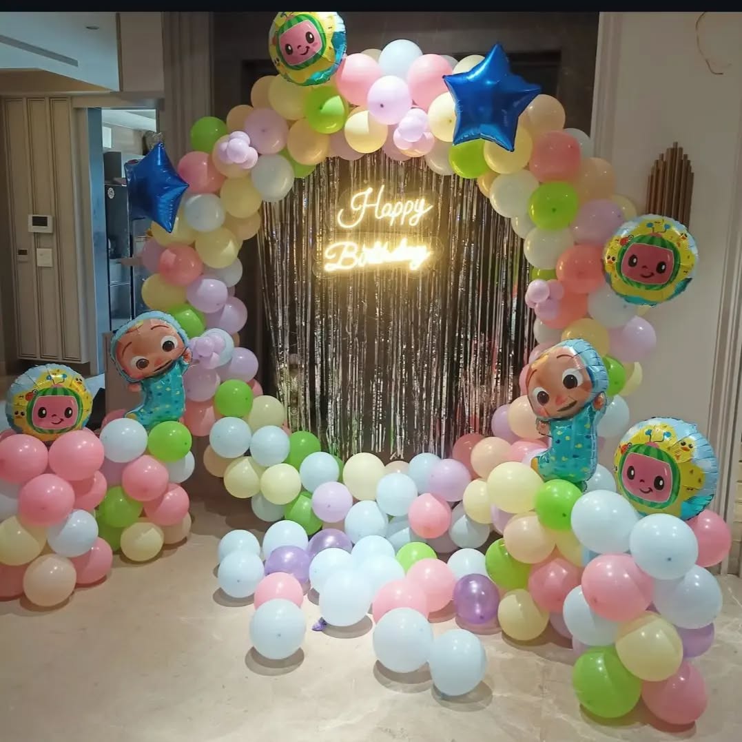 Pastel Cartoon Themed Balloon Arch with Neon Birthday Sign