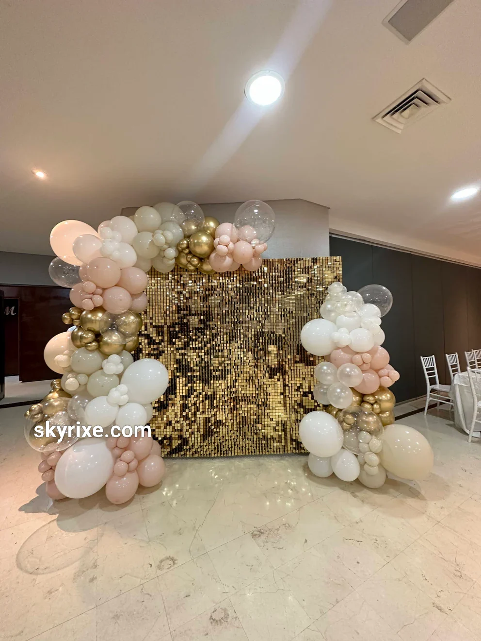 Gold sequin shimmer wall panel with stand